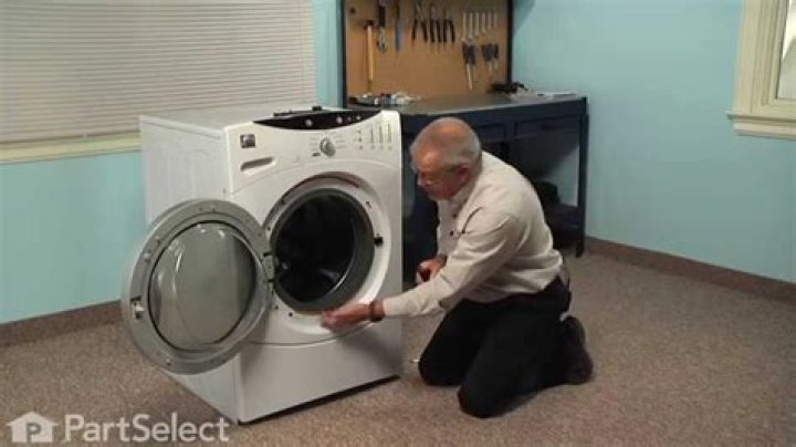 How do I unlock my GE washing machine door?
