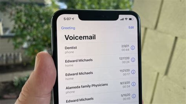 How do you change voicemail settings on iPhone?