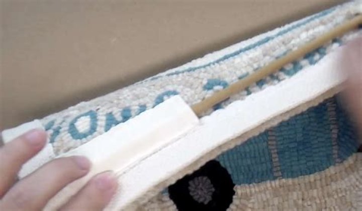 How do you hang a hooked rug?