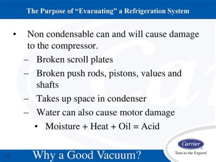 What is the purpose of evacuating a refrigeration system?